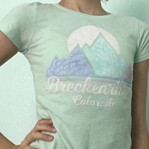 A teal and purple Breckenridge tee shirt